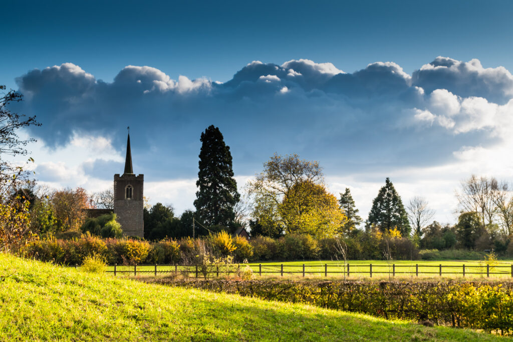 Green fields with church spire in the background, Bishop's Stortford, United Kingdom