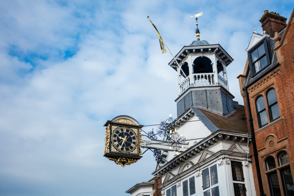 Guildford High Street, England. Main shopping Street with Clock