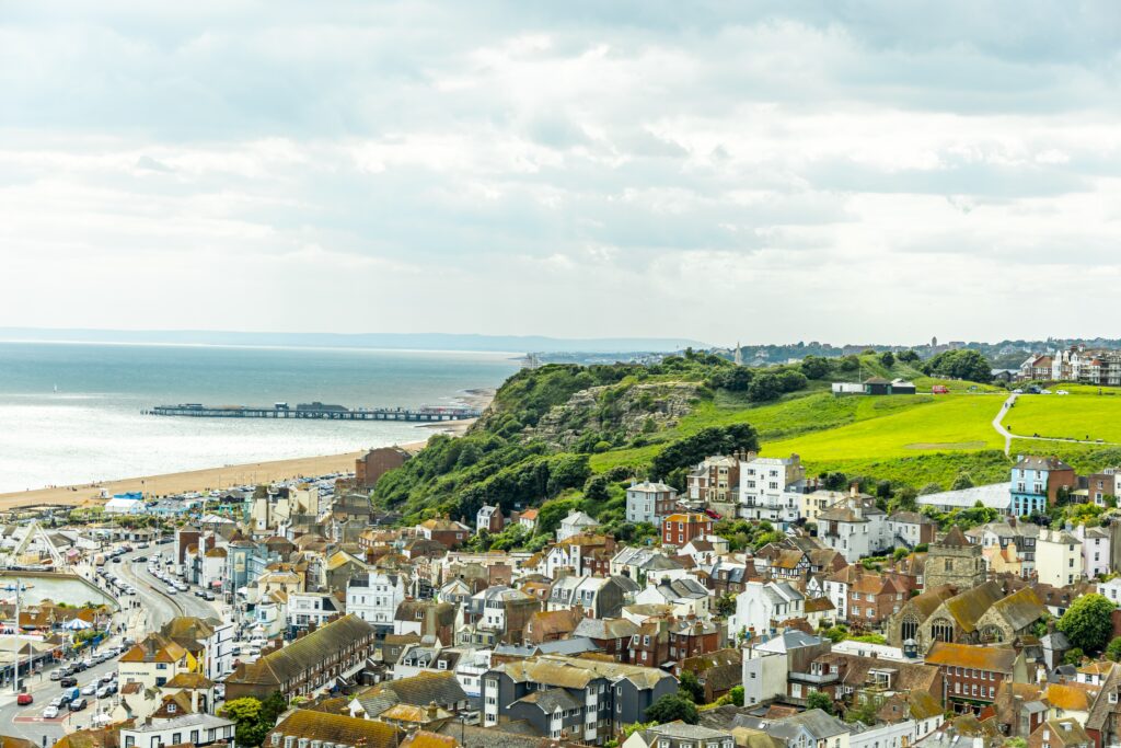 Aerial view of the harbour town of Hastings, overlooking the town houses down towards the beautiful seafront - Sussex - United Kingdom