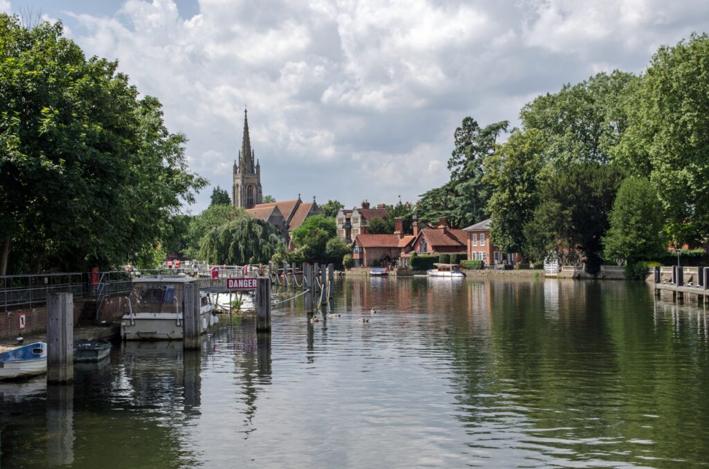 View on a sunny, summer afternoon down the river from the lock to the Buckinghamshire town of Marlow.