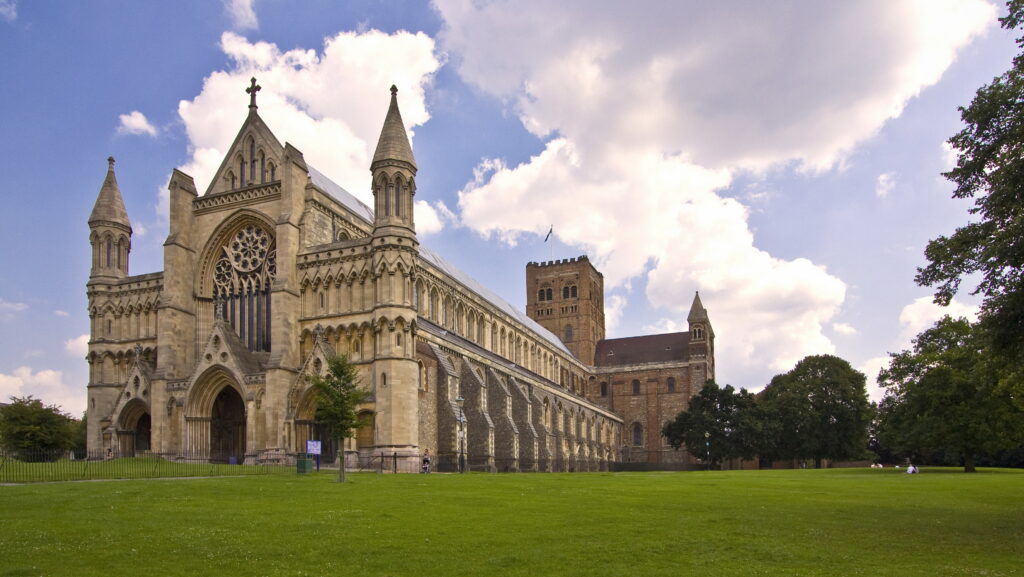View of Saint Albans Cathedral against a blue sky.
