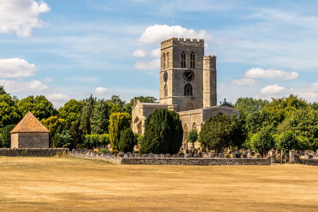 View of St Mary's Church and churchyard, Thame, Oxfordshire in summer.
