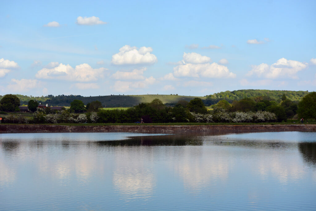 View across the water at Tring nature reservoir, Hertfordshire, during springtime.