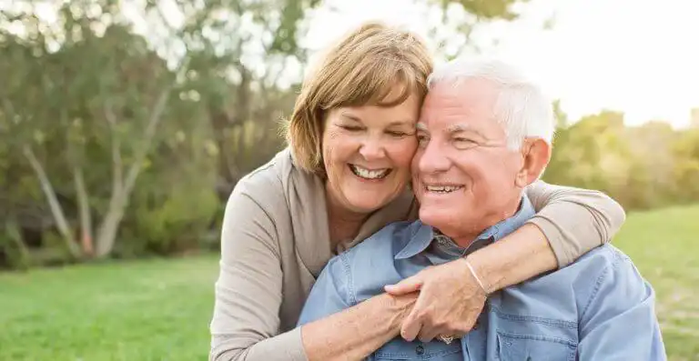 Older couple hugging