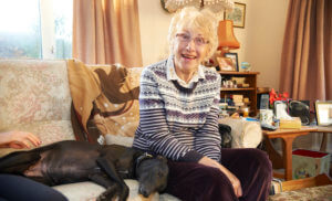 Care and independence-old lady on the sofa with dog