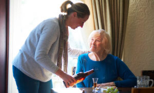 Hourly care-carer serving elderly lady