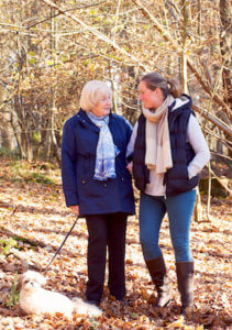 Dementia care-old lady with dog and carer