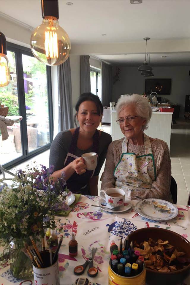 Urgent live in care-elderly lady having tea with carer
