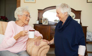 Urgent live in care-old lady having tea with friend